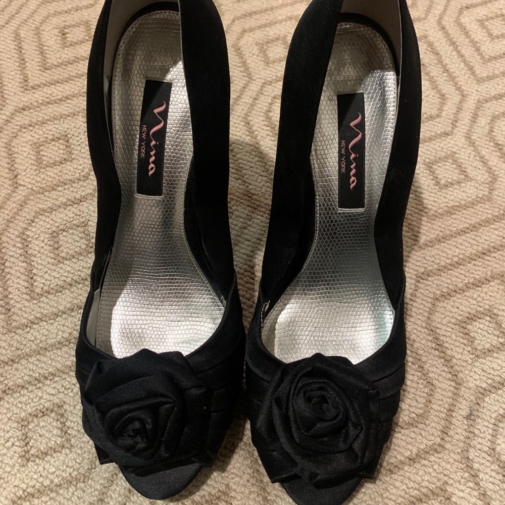 Black satin high heel pumps